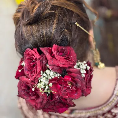 A classic floral bun for a Nikkah bride. I used fresh red roses and baby's breath to create this traditional and beautiful bridal hairstyle.