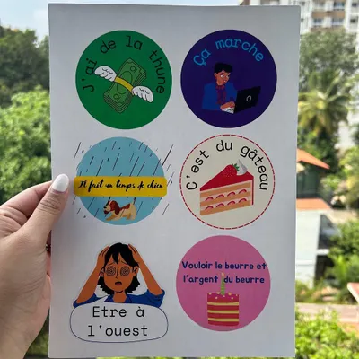 A sheet of our custom designed stickers featuring fun French idioms. We use these visual aids to make learning vocabulary and cultural expressions more memorable and enjoyable.