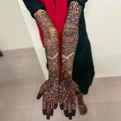 This is the complete bridal mehendi for Anha's wedding. The design extends up the arms with a mix of floral elements, traditional motifs, and fine line work for a truly grand celebration.