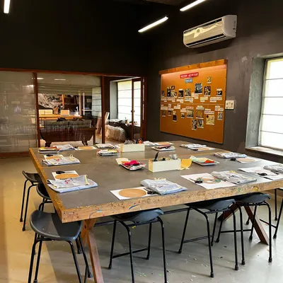 The studio is clean, organized, and ready for another day of creativity. I make sure the space is always prepared with fresh materials on our large communal table, inviting students to come in and start making art.