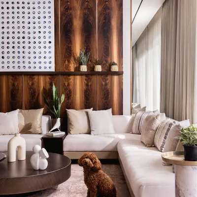 In our "Coffee, with a dash of Cream" project, a palette of plush whites, creams, and beiges creates a visually comfortable and luxurious living space. The mahogany wood paneling adds warmth and character.