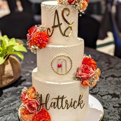 This grand 10kg, three-tier cake was the centerpiece for a formal felicitation event. Its textured buttercream, elegant floral arrangements, and custom gold lettering are designed to impress at any high-profile gathering.