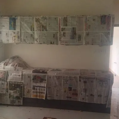 We begin every project by meticulously covering all furniture and surfaces with newspaper and sheeting to ensure complete protection from paint.