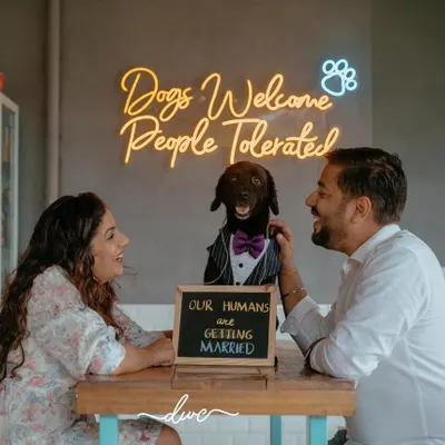 The perfect family portrait. This pre-wedding shoot includes the couple's furry friend, who proudly announces, "Our humans are getting married!"