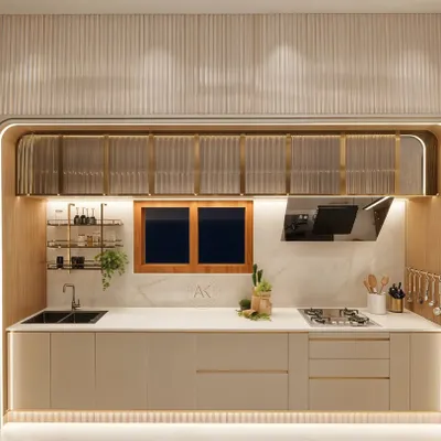 This view of the kitchen highlights the functional layout, with the sink and stovetop integrated into a seamless countertop. The fluted glass overhead cabinets, framed in brushed brass, provide elegant storage, while under-cabinet lighting ensures the workspace is both beautiful and practical. The design combines modern aesthetics with warm, tactile materials for a timeless feel.