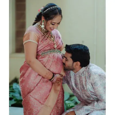 A quiet moment of connection before the arrival of your little one. I love capturing this pure anticipation and love. This outdoor maternity session focused on the couple's bond, using soft natural light to highlight the beautiful baby bump and their traditional attire.