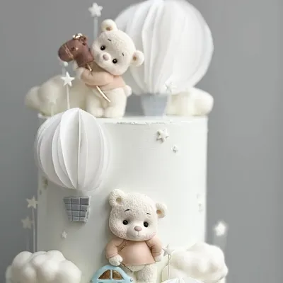 A close-up of the cutest teddy bear themed cake, with handcrafted bears and hot air balloons.