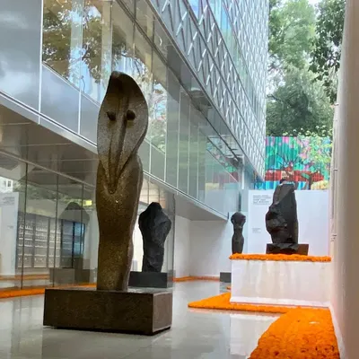 The entrance gallery at the Museum of Art & Photography (MAP) in Bangalore, featuring sculptures by Stephen Cox. The space is designed as a transitional zone, preparing the visitor for the experience within and showcasing the powerful dialogue between art and architecture.
