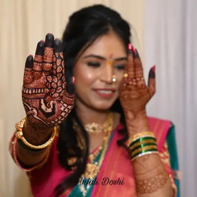 A perfect example of the dark, rich stain my natural henna achieves. The bride is happily showing off her palm's intricate design.