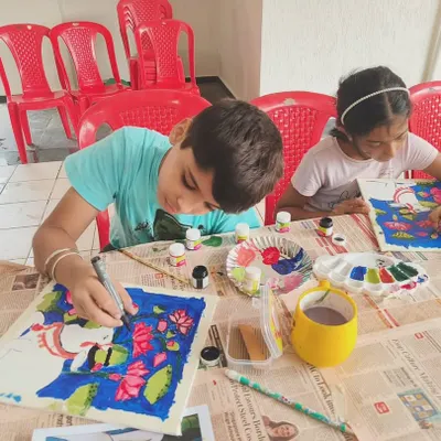 Young artists focused on their Pichwai paintings during a workshop. We provide all the materials and guidance to help children explore traditional art forms in a fun, supportive setting.