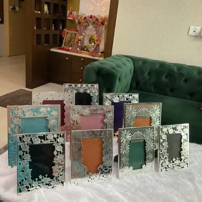 My silver photo frames are designed to turn your memories into heirlooms. Here is a collection of various designs, from floral cutouts to traditional motifs, each ready to hold your most cherished moments.