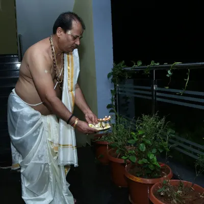 My practice is built on a foundation of daily spiritual discipline and faith. Here you can see me performing a traditional puja for the sacred Tulasi plant during a full moon, a ritual that cultivates positive vibrations and peace.