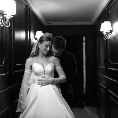 An intimate black and white moment between a bride and groom. Monochrome strips away distractions, focusing purely on the emotion and connection.