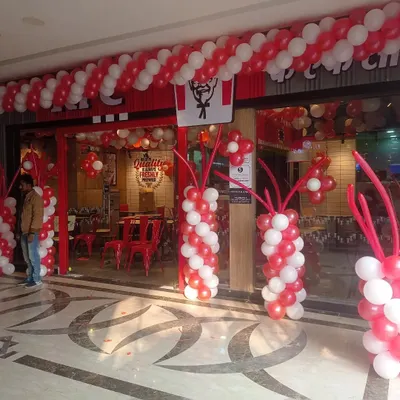 I handle commercial events and shop openings too. Here is the balloon decoration I did for a new KFC outlet, designed to match their brand colors and create an exciting atmosphere for the launch.