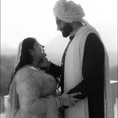An intimate black and white portrait of Rhea and Sai. The soft light and their gentle expressions create a timeless and romantic image that focuses purely on their connection.