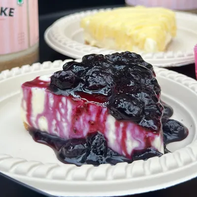 Our best-selling eggless Blueberry Cheesecake, featuring a rich, creamy texture and topped with a generous amount of our vibrant, house-made blueberry compote.