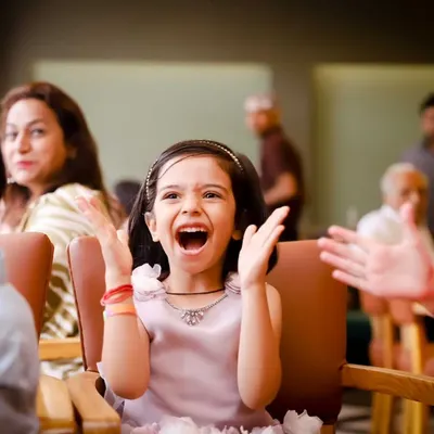 The pure excitement of a birthday party! We capture the candid reactions and joyful moments of kids enjoying the celebration.