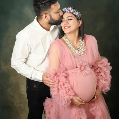 A tender kiss for the glowing mom-to-be. I love using beautiful gowns like this pink tulle one to add a touch of fairytale magic to my studio maternity sessions.