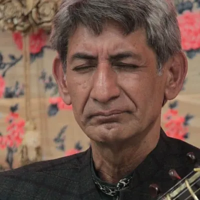 A moment of deep meditation from a Sitar recital during the 'Raghunathanjali' baithak, an event dedicated to musical reverence.