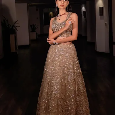 A full view of this stunning modern sangeet outfit. The makeup was designed to be bold yet elegant, with defined eyes and a flawless airbrushed finish that ensures you look perfect from every angle.
