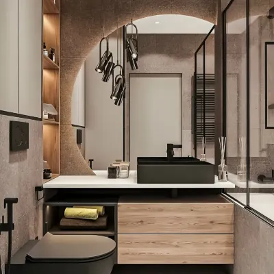 A sophisticated bathroom design featuring a unique arched mirror and dramatic pendant lighting. The combination of dark tiles, a black countertop sink, and light wood cabinetry creates a bold and luxurious look.