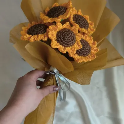 A full bouquet of our handmade crochet sunflowers, held together and ready to be gifted. The vibrant yellow and rich brown centers are designed to look just like the real thing, but these will brighten your home forever.