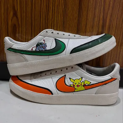 A side-by-side view of the custom Pokémon-themed Nikes. This angle shows how the designs on each shoe complement each other, creating a cohesive pair of hand-painted sneakers.