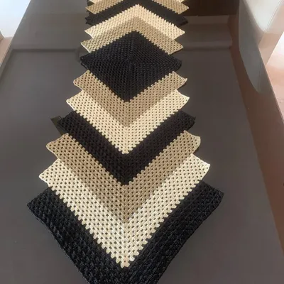 This chevron or ripple pattern table runner is one of my most popular modern designs. The mix of black, beige, and cream creates a sophisticated look that elevates any table.