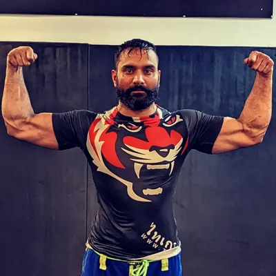 My mantra is "Eat, Sleep, Roll, Repeat," but I always add heavy lifting to the mix. Strength and power are critical for any fighter.