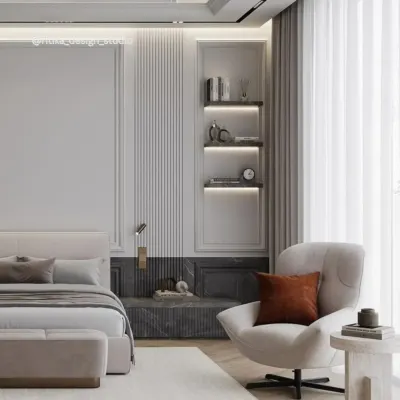 This angle showcases the cozy reading nook I created within the master suite. The comfortable armchair, combined with the built-in shelving with integrated lighting, provides a perfect spot to relax, demonstrating my focus on creating multi-layered, livable spaces.
