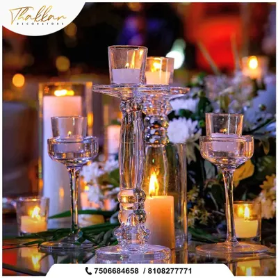 The soft glow of candlelight creates an unmatched romantic ambiance. I use a variety of crystal and glass candle holders to create beautiful, shimmering table centerpieces for evening events.