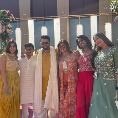 All smiles with the bride's squad after a fantastic Mehendi performance. Building a great connection with the wedding crew is key to a successful and fun sangeet.