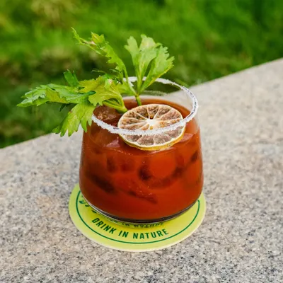 A classic Bloody Mary, bold and spicy, garnished with celery and a dehydrated lime wheel. The perfect brunch cocktail.