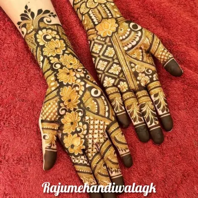 A full and heavy floral design that is perfect for a big festival like Diwali or Teej. The use of negative space makes the flowers stand out beautifully.
