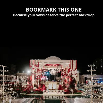 Your vows deserve the perfect backdrop. This spectacular mandap, set over a serene pool and adorned with cascading red florals and a crystal chandelier, created a dramatic and romantic setting for a night to remember.