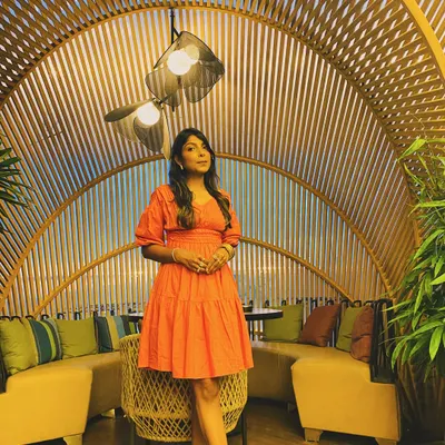 A perfect outfit for a cafe outing. This coral tiered mini dress with puff sleeves is fun, comfortable, and effortlessly stylish.