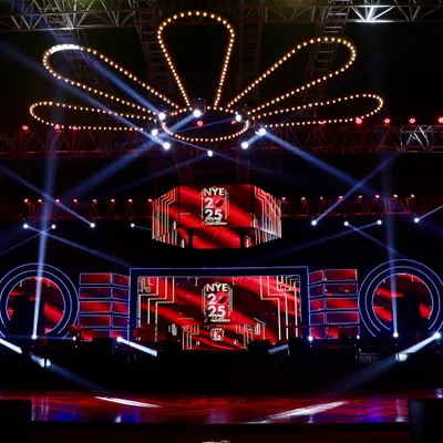 The centerpiece of our 'Scarlet Splendor' event was this massive stage, featuring a floral-patterned lighting truss and bold red and black graphics on the LED screens for a powerful, branded look.