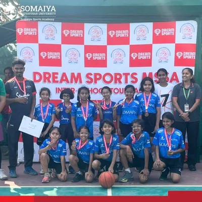 The Somaiya School U-11 Girls Basketball Team shows off their bronze medals after a thrilling victory at the MSSA Tournament.