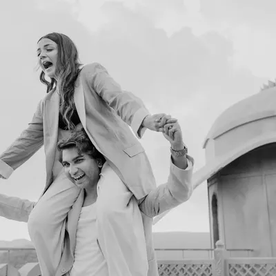 Pure, unscripted joy during a pre-wedding session in Jaipur. This candid black and white photo captures a playful piggyback ride, showing that the best moments are often the spontaneous ones.