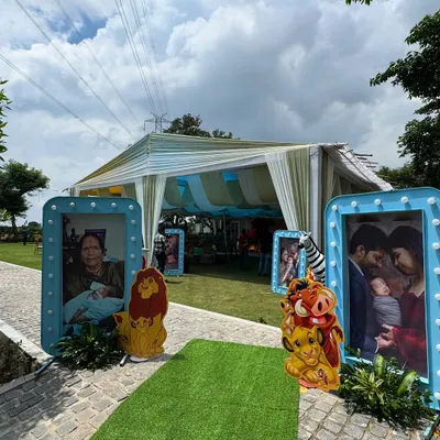 Hakuna Matata! For this first birthday, I created a Lion King theme, lining the entrance with large, framed family photos and cutouts of beloved characters like Simba and Pumbaa.