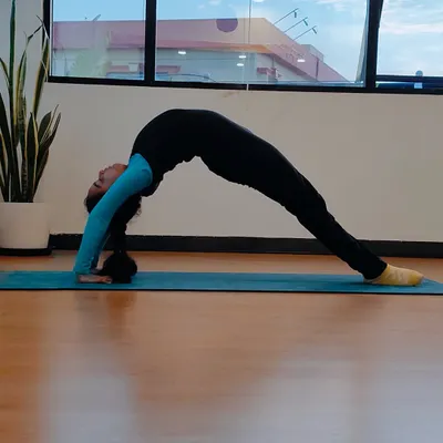 Meet Charvi, our very first kids' yoga student. Here she is in a graceful wheel pose, a symbol of the strength and confidence she has built since she first walked into our studio.