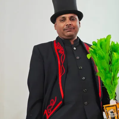 Dressed in my classic magician's attire, complete with a top hat and a colorful feather bouquet prop. I am always ready to bring a touch of showmanship and wonder to your event.