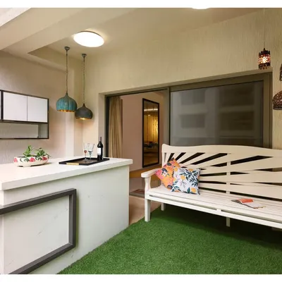 This stylish outdoor bar unit transforms a backyard into a chic hangout spot. It's the perfect setup for sunset cocktails or weekend barbecues, blending beauty with practicality for the ultimate outdoor entertaining experience.