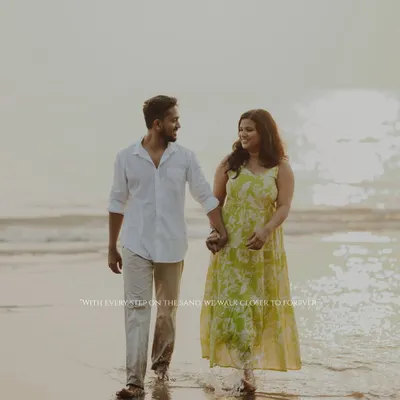With every step on the sands of Alibaug, we walk closer to forever. A beautiful, candid shot of a couple enjoying a romantic pre-wedding walk along the shoreline.