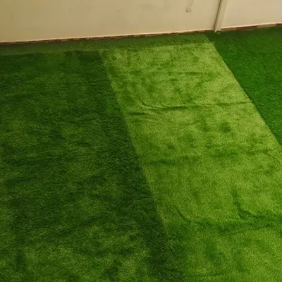 The final result of an artificial grass installation on a spacious balcony. It completely transforms the look and feel of the space, making it soft, green, and inviting.