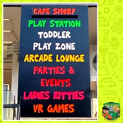 This sign at our entrance gives you a quick overview of everything we offer under one roof. Our facility includes a cafe, a main play station, a toddler zone, an arcade lounge, VR games, and space for parties and events.