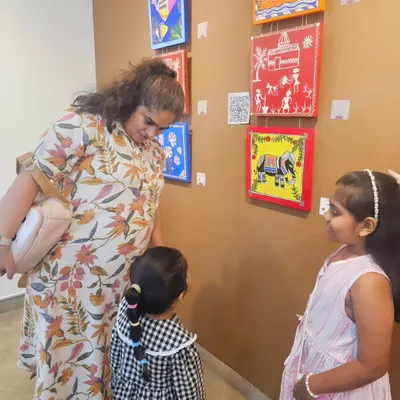Proud moments from our student exhibition. Here, our young artists are explaining the stories behind their traditional Warli and Madhubani artworks to visitors.