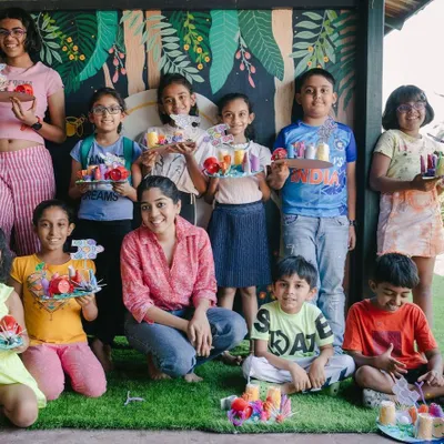 A group of proud artists from our summer art camp, showing off the 3D dioramas they created. We focus on the entire creative process, from initial idea to the final showcase for families.