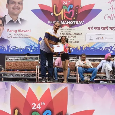 A moment of pride at the 24th Parle Mahotsav. One of our talented young students, Shivani Munda, receives her gold medal on stage. Her victory in the 9 to 14 girls' category is a win for the entire academy.