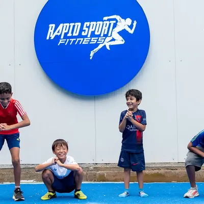 Fun is a key ingredient in our youth programs. Here, our young athletes are all smiles while practicing squat-hold positions at our Jayamahal center. We build foundational strength and proper form in a way that feels like play, ensuring kids stay engaged and motivated.